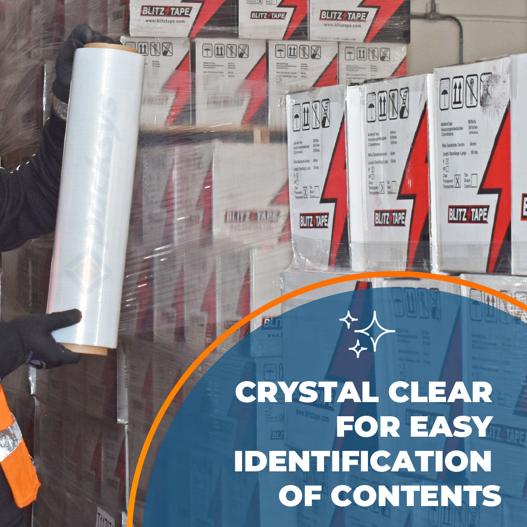 Clear hand stretch film being applied around stacked cartons
