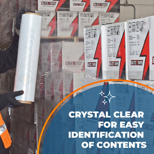 Clear hand stretch film being applied around stacked cartons